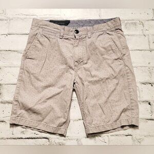 Armani Exchange Tan Shorts. The shorts have blue dots printed on them.